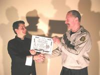 Tania Martin is congratulated by Sifu Hardy after an outstanding White Sash grading.