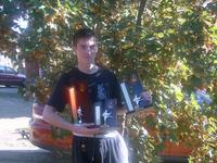 Luke Pedrana, with his trophies, outside the Queanbeyan Club - more than just a handful!