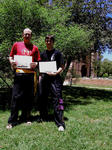 Shane and Luke with their certificates and new sashes, getting warm after training!