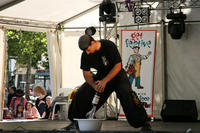 Sifu Patrick Bellchambers breaks the bottom out of one bottle with one hand .......