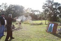 Master Doug White gladly instructed those Australiam Dragons who were interested in modern weapons - Here Master Hardy learns firearms handling