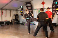 Tara James puts in a strong front kick in sparring at the Chinese New Year demonstration