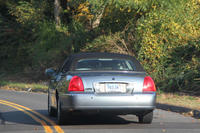 One of Grand Master St Charles' cars Pai Shinzan and his wife being on their way to their celebrations