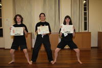 Charlie, Emily and Abby, smiling with their well-earned certificates and White Sashes!